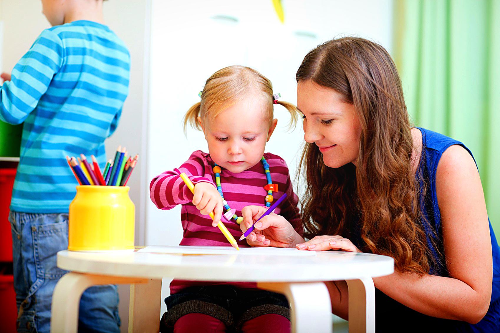 A child learning from a professional